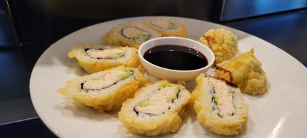 Inside: crab, avocado, cucumber
Outside: deep-fried in a tempura batter, drizzled with sweet sauce