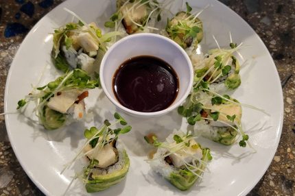 Inside: cucumber, deep fried asparagus, tofu
Outside: avocado, sprouts, drizzled with ponzu sauce