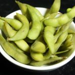 A bowl of freshly steamed soy beans, served lightly salted