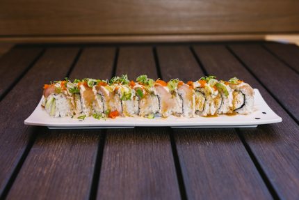 Inside: crab and cucumber
Outside: albacore, avocado, garlic and cream sauce, green onion and masago