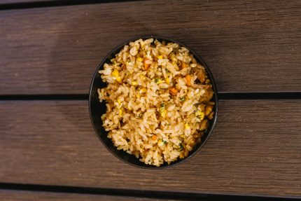 A delicious bowl of fried rice mixed with egg and vegetables