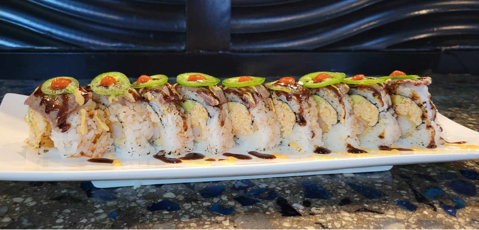 Inside: shrimp tempura, spicy crab and avocado
Outside: seared tender fillet mignon and sliced jalapeno drizzled with sweet and spicy sauce - our most unique and delicious roll