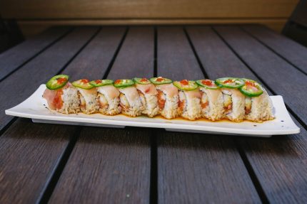 Inside: spicy tuna, shrimp tempura and cucumber
Outside: fresh yellow tail, ponzu, jalapeno slices with a dab of sriracha