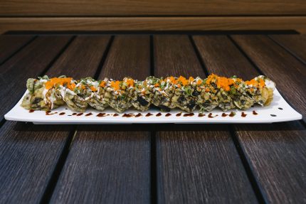 Inside: crab, shrimp, cream cheese and avocado
Outside: deep fried in tempura batter and drizzled with cream & sweet sauce,
topped with masago and green onion