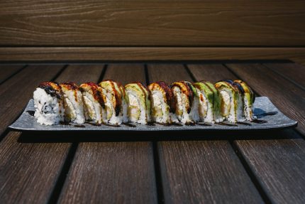 Inside: shrimp tempura, crab meat, avocado and cucumber Outside: freshwater eel and avocado drizzled with sweet sauce
