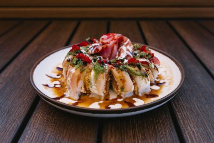 Inside: spicy tuna, spicy crab, shrimp tempura
Outside: tuna, albacore, avocado with assorted sauces and tobico, featuring a delicious tuna rose