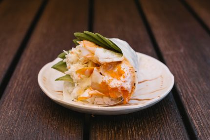 A delicious blend of scallops, shrimp, crab meat, avocado, gobo root and tobico, mixed in a spicy cream sauce, wrapped in soy paper.